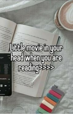 an open book, headphones and cup of coffee on a bed with the words little movie in your head when you are reading