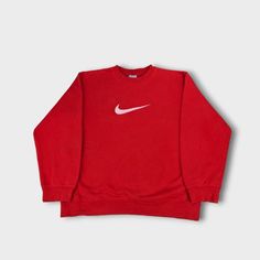 Vintage Nike 00s red sweatshirt  Embroidered white centre swoosh, couple tiny marks on front  Youth large fits like a women's size 8 - pit to pit 20 inches, length 24 inches   ♻️ Eco friendly recyclable packaging  Note: Items are vintage and may have some small marks or show signs of wear, however anything major will be shown and noted.  Storage code - SH2B1 Red Top With Embroidered Logo For Streetwear, Red Cotton Sweats For Streetwear, Red Sporty Sweatshirt With Embroidered Logo, Sporty Red Sweatshirt With Embroidered Logo, Casual Red Crew Hoodie, Sporty Red Sweater For Streetwear, Red 90s Style Streetwear Sweater, Red Long Sleeve Top With Embroidered Logo, Red Hoodie With Logo Print And Crew Neck