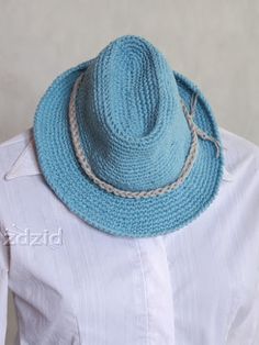 a woman wearing a blue hat and white shirt