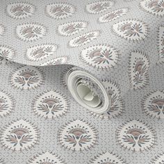 a close up view of a wallpaper with an intricate design on the surface and white background