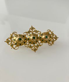 It is a brooch / pendant. Spanish, dating from the 18th Century. These types of pieces are very rare, since they were donated to churches for the crowns of the virgins and other goldsmiths. It is for a collector of high-quality Spanish jewelry. epoch. Approx. measurements, 6.3x 3.3cm. Weight, 12.8cm. Antique Baroque Brooches With 17 Jewels, Ceremonial Gold Brooches With 17 Jewels, Traditional Yellow Gold Brooches For Formal Occasions, Traditional Yellow Gold Formal Brooches, Victorian Baroque Brooches As Gifts, Ornate Yellow Gold Wedding Brooch, Ceremonial Hallmarked Pendant Brooch, Antique Hallmarked Brooches For Ceremonial Occasions, Ornate Pendant Brooch For Ceremonial Occasions