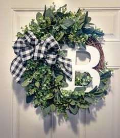 a wreath with the letter b on it