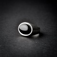 A handmade sterling silver 925 oval shaped black onyx stone signet ring.Each ring is cleaned and polished with care.The weight of the ring may vary according to size.Top measurements: Width - 18.7mm | Height - 15.4mmApprox weight: 7.96grThe ring is set with one horizontal oval shaped black onyx stone.*The ring is hollowed out from the inside*This ring is made to order! Please allow up to 21 business days to be made before shipment. If you have any further questions, please don’t hesitate to cont Timeless Onyx Signet Ring With Polished Finish, Minimalist Silver Onyx Signet Ring, Classic Black Signet Ring With Polished Edges, Silver Onyx Signet Ring With Polished Finish, Modern Black Sterling Silver Signet Ring, Black Sterling Silver Signet Ring With Polished Finish, Sterling Silver Signet Ring With Polished Oval Cabochon, Classic Black Sterling Silver Signet Ring, Sterling Silver Oval Cabochon Signet Ring With Polished Finish