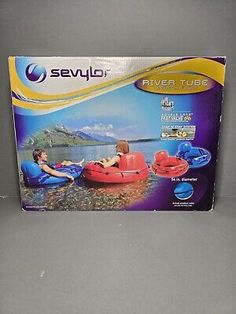 an inflatable raft with two people sitting on it and the box is open