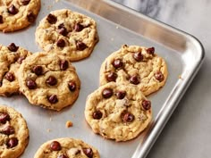 chocolate chip cookies on a cookie sheet ready to be baked in the oven for consumption