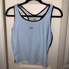 Light Blue, Semi Cropped Tanktop. Built In Sports Bra. Almost Brand New Condition Light Blue Sporty Moisture-wicking Top, Sporty Light Blue Moisture-wicking Tops, Light Blue Moisture-wicking Athleisure Top, Moisture-wicking Light Blue Workout Top, Nike Tops For Gym In Spring, Light Blue Sporty Tops For Gym, Blue Sportswear Top For Summer, Light Blue Sporty Gym Tops, Nike Sporty Sleeveless Tops