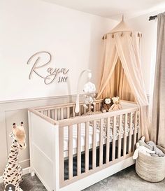 a baby's room with a crib and stuffed animals