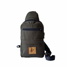 This crossbody bag is your ultimate adventure buddy for both city excursions or the outdoors. Made with ethically-sourced water-resistant canvas, it has clips on both sides so you can wear it over your left or right shoulder, front or back.   Inside, you'll discover a spacious main compartment with a convenient divider, plus two handy pockets on the front for quick access. Oh, and here's the kicker: there's even a sneaky hidden zippered pocket in the back for some extra security. ✔Crafted from 100% Fair Trade cotton canvas. ✔ Traditional African "kitenge" fabric highlights on the inside (different for each bag!) ✔Hand wash and hang dry Outdoor Canvas Lined Shoulder Bag, Canvas Shoulder Bag Backpack For Outdoor Activities, Outdoor Canvas Backpack With Adjustable Strap, Casual Bags With Canvas Lining For Outdoor Activities, Green Canvas Shoulder Bag For Outdoor Activities, Casual Bags For Outdoor Activities With Canvas Lining, Green Canvas Shoulder Bag For Outdoor, Canvas Shoulder Bag With Zipper Pocket For Outdoor Activities, Functional Bags With Canvas Lining For Outdoor Activities