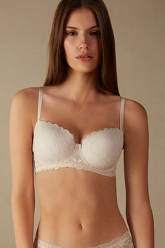 Sofia balconette bra with lightly padded cups and snug underwire that hugs and supports the bust. Made in soft and comfortable stretch lace that features a geometric design and romantic ruffles. The underband is lined in tulle to ensure greater hold to the body. The straps are lined with microfiber and are adjustable in back, while in larger sizes they are made entirely of elastic to provide complete adjustability. The underband in larger sizes is always wider and a support comes inserted in the Elegant Seamless Bra With Sweetheart Neckline, Elegant Bra With Sweetheart Neckline And Adjustable Straps, Elegant Bra With Sweetheart Neckline And Removable Cups, Elegant Strapless Bra With Padded Cups, Elegant Sweetheart Neckline Bra With Removable Cups, Elegant Beige Bra With Adjustable Straps, Elegant Balconette Bra With Removable Cups, Elegant Balconette Bra With Removable Pads, Elegant Seamless Underwire Bra