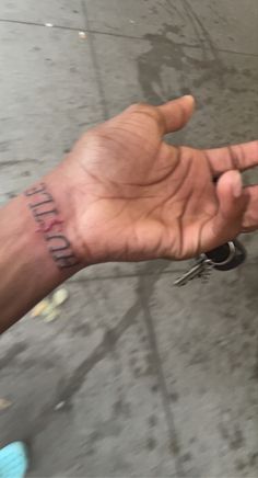 a person holding their hand out with the word fluff on it and two keys in front of them