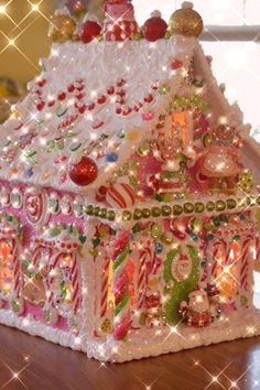 a lighted gingerbread house on a table