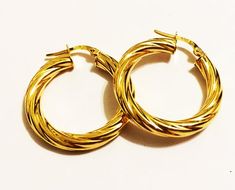 Fancy swirly hoop earrings:metal       : solid 14k yellow goldweight     = 2.2 grdiameter = 1"inch (23mm)thick        = 4 mmclosure    : snap-downmade       : in Italy Swirly Designs, Thick Hoop Earrings, Evil Eye Pendant, Lovely Earrings, Fine Jewelry Gift, Gold Hoops, Rose Gold Earrings, Jewelry Earrings Hoops, Gold Hoop