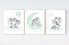 three elephants are sitting on the moon and one is holding a baby's hand