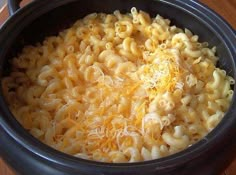 a crock pot filled with macaroni and cheese