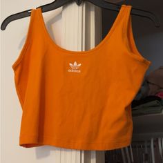 Adidas Cropped Tank. Never Worn. M. Adidas Cotton Tank Top For Spring, Adidas Casual Summer Tank Top, Casual Adidas Summer Tank Top, Adidas Sporty Cotton Tank Top, Adidas Casual Cotton Tank Top, Adidas Tops For Summer, Adidas Summer Sleeveless Tops, Casual Adidas Cotton Tank Top, Adidas Casual Sleeveless Top