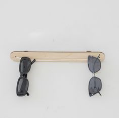 Introducing our Plywood Sunglasses Wall Display Shelf, the perfect solution for stylishly organizing and showcasing your sunglasses collection. Crafted from premium plywood, this sleek and modern display shelf is designed to enhance any space while providing a functional storage solution for your eyewear. The shelf features multiple slots and compartments, each carefully designed to securely hold and display your sunglasses, keeping them easily accessible and well-organized. The natural wood finish of the plywood adds a touch of warmth and sophistication to your decor, making it a visually appealing addition to any room. Designed with a slim profile, this wall-mounted shelf saves space while offering a practical and stylish way to display your sunglasses. Whether you're a fashion enthusias Sunglass Hanger, Sunglass Rack, Sunglasses Hanger, Sunglass Organizer, Sunglasses Wall, Sunglass Display, Eyewear Display, Sunglasses Organizer, Sunglasses Display