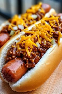 a hot dog with chili and cheese on it