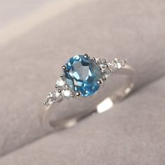 * The delicate ring displays swiss blue topaz as main stone. The cluster side stones make the ring similar to the blooming flower . For who wearing this special & delicate ring, will shine like a goddess. ◆ Production Description: Main stone Type: swiss blue topaz Main Stone Shape: Oval Cut Main Stone Size: 6*8mm (1.47ct) Side stone: CZ Metal: 925 Sterling silver - Other options available in the drop down menu ◆ Customization: √Free for Add Engraving √Other Metal Type Available √Other Gemsto Light Blue Promise Ring, Silver Blue Engagement Ring, Blue And Silver Engagement Ring, Oval Light Blue Topaz Ring, Light Blue Oval Topaz Ring, Oval Turquoise Topaz Ring For Wedding, Promise Rings Blue, Light Blue Engagement Ring, Blue Stone Engagement Ring