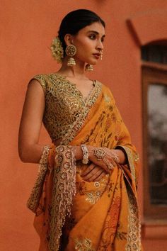 Marigold saree with all over handpainted kalamkari floral blossom motifs, highlighted by honeycomb sequin cutwork embellishments. Comes with matching cutwork blouse. - Aza Fashions Anarkali Saree With Resham Embroidery, Anarkali Saree With V-neck And Resham Embroidery, V-neck Choli With Dupatta For Diwali, Diwali V-neck Choli With Dupatta, Anarkali Saree With V-neck And Dupatta, Reception Saree With V-neck Pallu, V-neck Saree With Pallu For Reception, V-neck Saree With Resham Embroidery For Diwali, V-neck Reception Saree With Pallu