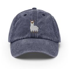 Step up your hat game with this exquisite Vintage Baseball Cap featuring an embroidered Llama design. Perfect for animal lovers and vintage enthusiasts alike, this cap effortlessly combines timeless style and a touch of canine adoration. Whether you're heading on a dog walk, strolling through town, or simply want to add a dash of retro flair to your outfit, this cap is a must-have accessory. Key Features: Authentic Vintage Appeal: Crafted with a love for the classics, this baseball cap boasts a vintage design that exudes timeless charm. It's a nod to the golden era of baseball and a stylish addition to any outfit. Detailed Embroidered Llama: The cap showcases a meticulously embroidered design on the front, showcasing the beauty of this unique animal. Comfortable and Adjustable: Made from h Adjustable Hat With Embroidered Logo And Curved Brim, Adjustable Curved Brim Hat With Embroidered Logo, Curved Bill Hat With Embroidered Logo, Adjustable Hat With Embroidered Logo, Adjustable Flat Brim Hat With Embroidered Logo, Embroidered Adjustable Dad Hat With Flat Brim, Vintage Canvas Baseball Cap, Vintage Adjustable Baseball Cap With Letter Patch, Vintage Baseball Cap With Embroidered Curved Brim