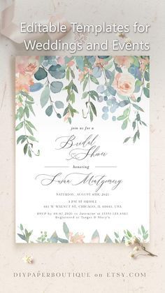 an elegant wedding card with flowers and greenery