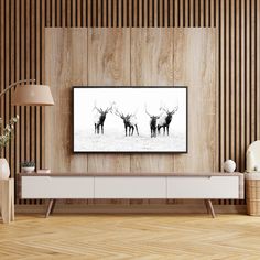 a living room with wood paneling and a television mounted on the wall above it