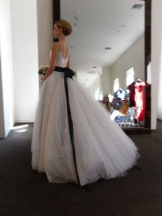 a woman in a white and black wedding dress