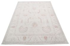 a white rug with an intricate design on the top and bottom, is shown in full view