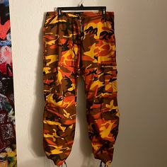 Size Small Rothco Camouflage Cargo Pants, Great Condition- Never Worn ~Low Drawstring Waist And Ankle Drawstrings~ Camouflage Cargo Pants, Black Orange, Track Pants, Orange Black, Drawstring Waist, Cargo Pants, Camouflage, Pant Jumpsuit, Pants For Women