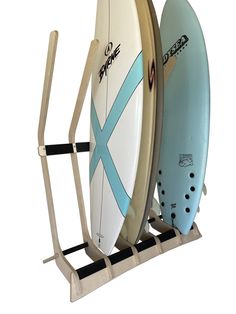 two surfboards are mounted to a rack on a white background, one is blue and the other is beige