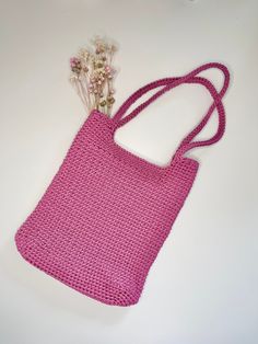 Here's something that is sure to get your attention! Our gorgeous pink shopper bag made on crochet is the perfect addition to your closet. It was handmade and is very practical. It will hold everything you need during the day. Its dimensions are 24 cm wide, 28 cm high, and the handle is 23 cm long. This beautiful handbag adds charm to any styling, and is perfect for any occasion. Don't delay and add it to your collection today! Trendy Pink Crochet Bag With Adjustable Strap, Eco-friendly Pink Shoulder Bag For Everyday, Casual Pink Crochet Bag For Daily Use, Everyday Pink Beach Bag With Adjustable Strap, Trendy Pink Crochet Tote Bag, Pink Square Crochet Beach Bag, Pink Casual Crochet Tote Bag, Pink Square Crochet Bag For Beach, Casual Pink Crochet Tote Bag