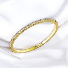 💎 14K Solid Gold Dainty Diamond Eternity Band, Anniversary Eternity Ring *Metal: 14K Solid Gold (Yellow, White, or Rose) *Diamonds:      - Cut: Round     - Clarity: VS     - Size: 1 mm      - Total Carat Weight (CTW): 0.2     - Ring Size: Available in various sizes, custom sizes upon request Perfect For: Anniversary Gifts Wedding Bands Milestone Celebrations A Gift of Eternal Love Unveil the enchanting allure of eternal love with the Kai Real 14K Gold Natural Diamond Eternity Band. Exclusively Gold Half Eternity Wedding Band, Gold Cubic Zirconia Halo Eternity Band, Yellow Gold Eternity Band With Halo Design For Anniversary, Yellow Diamond Halo Ring For Wedding, Yellow Gold Halo Eternity Band For Wedding, Gold Half Eternity Band Gift, Gold Round Eternity Band For Wedding, Gold Eternity Band With Halo For Anniversary, Gold Half Eternity Band As A Gift