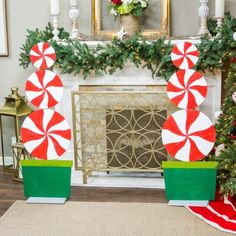 christmas decorations in front of a fireplace decorated with candy canes