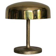 a brass table lamp on a white background