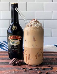 a bottle of bailey's chocolate milkshake next to an iced drink