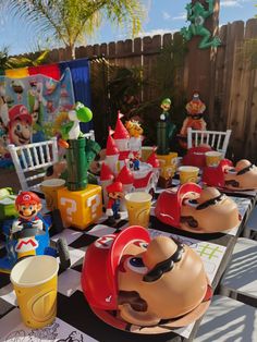 a table topped with lots of toy figurines on top of checkered tables