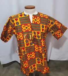 Round Neck Dashiki shirt Short Sleeves Tailored Dashiki shirt made with very Quality Dashiki Fabric.  Ready To Ship CARE INSTRUCTIONS:  Dry Clean Recommended DO NOT BLEACH Press with warm iron on the wrong side ALL SALES ARE FINAL African Dashiki Shirt, Dashiki Shirt, Mens Dress Shirts, African Dashiki, Mens Dress, Tee Dress, African Clothing, Mens Shirt Dress, Dress Shirts