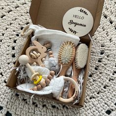 a box filled with wooden toys on top of a rug