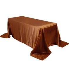 a brown table cloth on top of a wooden table