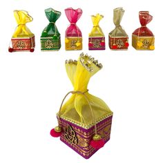 an assortment of different types of perfumes in colorful bags with ribbons and bows on them