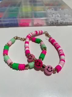 Watermelon themed beaded bracelets. Handmade bracelets with elastic bands. Playful Adjustable Friendship Bracelets With Round Beads, Adjustable Playful Friendship Bracelets With Round Beads, Adjustable Pink Friendship Bracelets With Spacer Beads, Trendy Pink Heishi Beads, Novelty Green Beaded Bracelets, Pink Heishi Beads Friendship Bracelets For Festival, Trendy Pink Beads For Festival, Casual Pink Beaded Bracelets For Festivals, Casual Pink Beads For Festivals