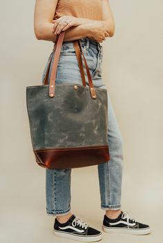 One of our most popular bags. Perfect for the minimalist yet still practical. It includes six interior pockets for privacy and organization. Longer shoulder straps for added comfort. Snap closure. Popular Bags, Black On Black, The Minimalist, Waxed Canvas, Natural Leather, Snap Closure, Shoulder Straps, Bucket Bag, Most Popular