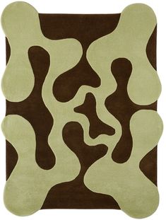 a brown and green rug with an abstract design