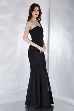 Black fish cut gown with one shoulder sleeve. - Aza Fashions Formal One-shoulder Fitted Gown, Black Gown With Asymmetrical Neckline For Prom, One-shoulder Gown With Fitted Bodice For Cocktail, One Shoulder Gown With Sweep Train For Cocktail, One-shoulder Gown With Sweep Train For Cocktail, One-shoulder Fitted Bodice Cocktail Gown, Black Prom Gown With Asymmetrical Neckline, One Shoulder Fitted Gown For Gala, One-shoulder Fitted Gown For Gala