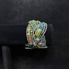 "About Color Multi Colored Beaded Wire Cuff Bracelet. It measures: 7\" X 1 5/8\" It comes with a gift box. (Jewelry # 3666) USA Seller!!6 Estate sale find. We do not Clean or Polish our Estate Jewelry we will leave that to you. We also have Jewelry, Hallmark Ornaments, Dept 56, Vintage Glassware and many other items. We will combine shipping for multiple items if possible. Features: * Cuff Bracelet Size: Womens 7\" Condition: Pre-Owned Like New" Multicolor Cuff Bracelet With Colorful Beads, Vintage Multicolor Handmade Cuff Bracelet, Vintage Multicolor Metal Beaded Bracelets, Vintage Handmade Multicolor Cuff Bracelet, Hand-strung Vintage Multicolor Beaded Bracelets, Wire Cuff Bracelet, Gift Box Jewelry, Wire Cuff, Dept 56