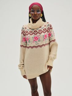 Designed for winter strolls, the Ski Lodge cream sweater exudes a sweet nostalgic mood. Crafted in a cashmere blend, this oversized sweater spotlights a turtleneck, rib trims, and whimsical floral patterns. Wear it as a dress or over your favorite vintage jeans. Ski Lodge, Wedding Lingerie, Cream Sweater, Kids Sweater, Outerwear Sweater, Oversized Sweater, New Wardrobe, Floral Patterns, Vintage Jeans