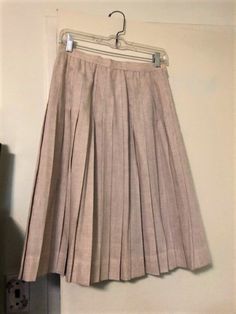 "Vintage Rene Portier pleated oatmeal skirt, size 10 (waist approximately 28\", length approximately 25 3/4\"), made out of poly and viscose, in very good condition with a few red marks on the waistband" Fitted Beige Bottoms With Accordion Pleats, Beige Pleated Skirt For Spring Formal Occasions, Beige Pleated Skirt For Spring Formal, Formal Beige Pleated Skirt For Spring, Spring Formal Beige Pleated Skirt, Fitted Beige Accordion Pleats Skirt, Fitted Beige Pleated Skirt With Accordion Pleats, Cream Full Pleated Lined Skirt, Beige Flared Accordion Pleated Skirt