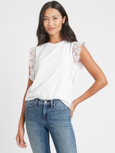 BACK IN STOCK: You loved this style so much we're bringing it back! Easy on the eyes.  This cute tank has rows of ruffled lace at the sleeves for a luxe, textured look.  Crew neck.  Sleeveless.  Straight hem.  Semi-fitted.  Hip length - designed for mid-rise and high-rise styles.  Body length (size S): Regular 23. 75" Model: Size XS, 5'10" (178cm). Summer Cotton Lace Top With Lace Sleeves, Summer Tops With Lace Trim And Ruffle Sleeves, Summer Ruffle Sleeve Tops With Lace Trim, Ruffle Sleeve Tops With Lace Trim For Summer, Chic Crew Neck Top With Lace Sleeves, Sleeveless Cotton Lace Top With Ruffles, Feminine Cotton Tops With Lace Sleeves, Casual Tops With Lace Sleeves And Crew Neck, Spring Lace Top With Ruffle Sleeves