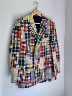 This amazing mens blazer from the 80's is so high quality.  Tailor made with posh details in the lining, this fits like a 44 regular. This is a posh coat in good condition.  One of the plaid swatches on the front bottom looks to have the red dye running a bit - not noticeable at all and might rectify with a good dry cleaning.   Measures 22" flat across the chest and is 30" long.  Sleeves are 23.5" from shoulder to cuff. Winter Fitted Plaid Sport Coat, Winter Plaid Fitted Sport Coat, Fitted Plaid Sport Coat With Long Sleeves, Plaid Cotton Blazer For Fall, Tailored Plaid Sport Coat With Long Sleeves, Plaid Single Breasted Sport Coat For Spring, Plaid Single-breasted Sport Coat For Spring, Winter Cotton Sport Coat With Suit Collar, Tailored Plaid Sport Coat For Spring