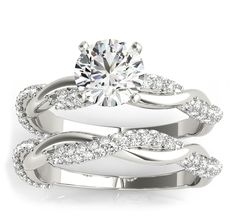 a white gold wedding ring set with an oval diamond center and twisted shans on the band